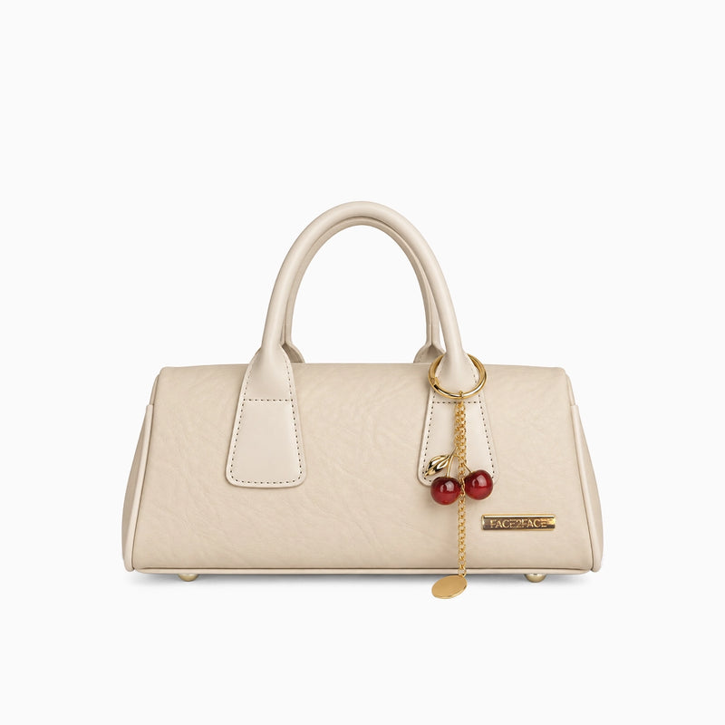 Bolso de mano pequeño en color beige con correa removible