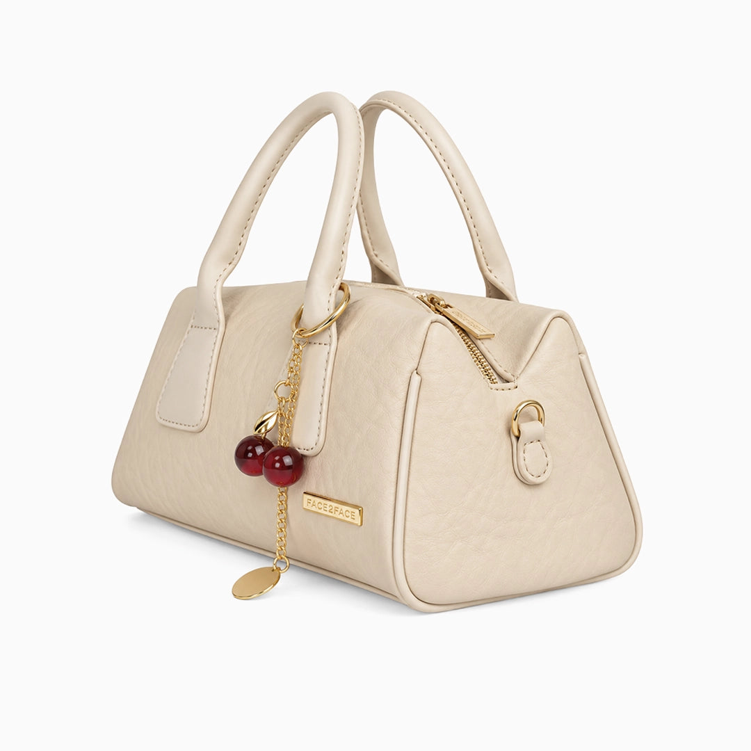 Bolso de mano pequeño en color beige con correa removible