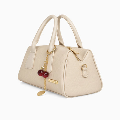 Bolso de mano pequeño en color beige con correa removible