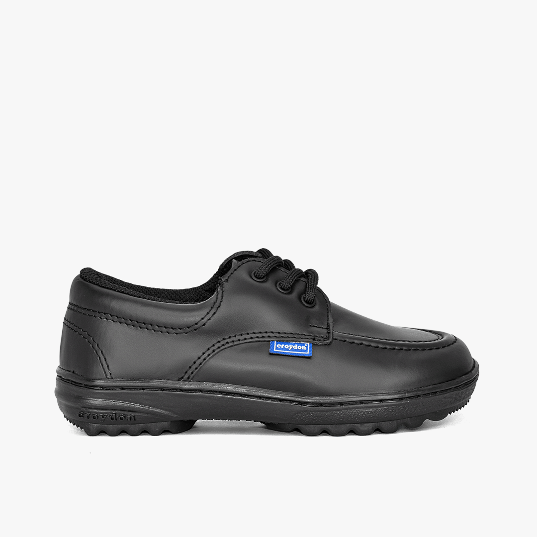 Zapato Croydon colegial unisex en color negro